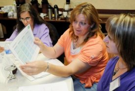 Instructors at an IFL workshop explore teaching forms available from ABMP to build instructor clarity and improve student academic performance.