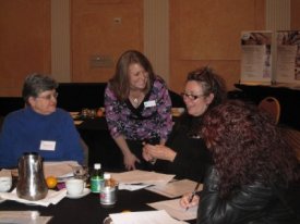 ABMP Education Facilitator Kristin Coverly takes part in a lively group discussion at an IFL workshop. 
