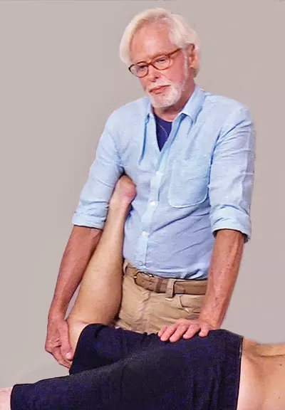 Erik Dalton continues to perform a hip stretch, mobilizing the rectus femoris.