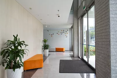 a shared hallway in a bright office building.