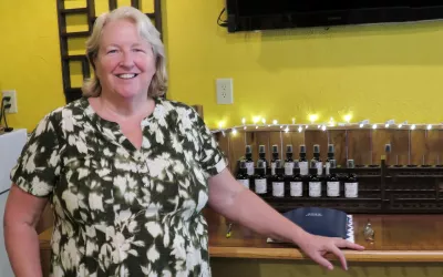 Debbie Pennington stands in the building where she practices massage. 