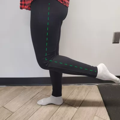 A client bends their leg at the knee.
