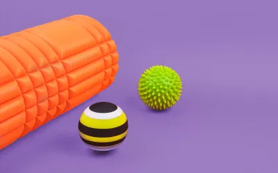 A therapy roll and two therapy balls.