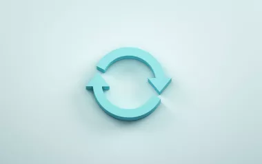 two blue arrows moving in the same direction, indicating a full circle. 