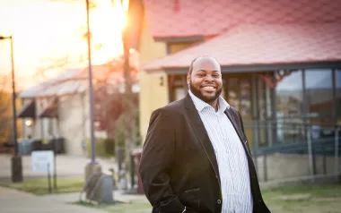 portrait of Terrance Bonner in a black suit jacket and white shirt.
