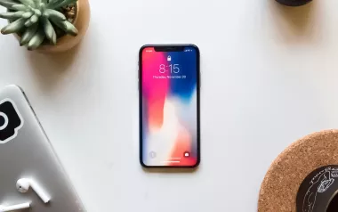 A mobile phone rests on a table.