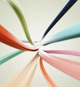 conceptual, multicolored wires coming together at an end point