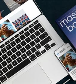 laptop keyboard, smartphone and Massage &amp; bodywork magazine