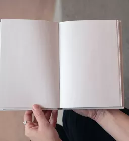 an open, blank white book.