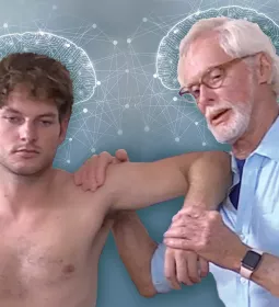 Erik Dalton moves and adjustes a male client with brain wave graphics in the background.