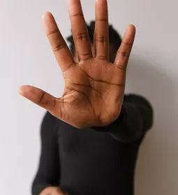 Man holding hold up to demonstrate stopping.