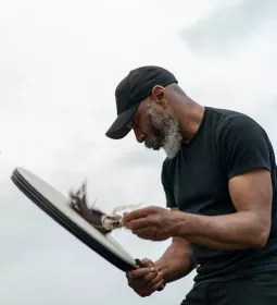 Ben Brown, LMT, playing a drum.