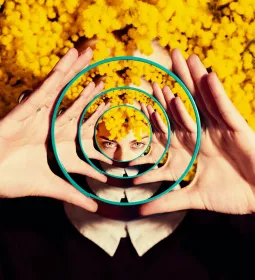 Reflection of woman in many mirrors.