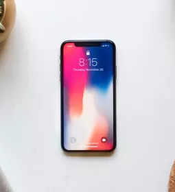 A mobile phone rests on a table.