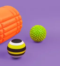 A therapy roll and two therapy balls.