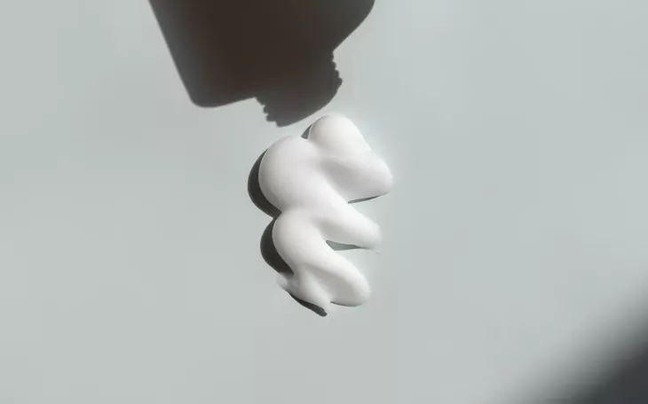 Cream comes out of a tube.