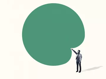 a person points toward a bank green bubble above their head.