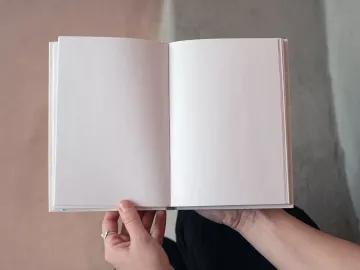 an open, blank white book.