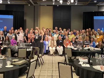 Attendees of the 2022 ABMP School Forum pose for a group picture.