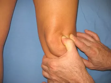 Lateral movement during massage as treatment for the patella. 