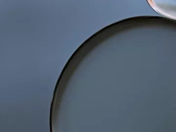 Abstract circles in clear, black, and gray colors.