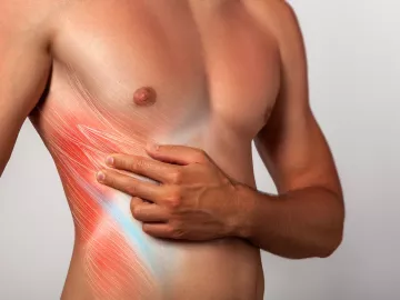 A male figure pulls hands and fingers across his transversus abdominis muscles.