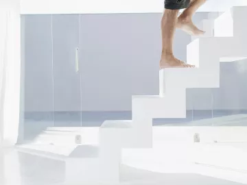 Man walking up steps. 