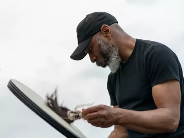 Ben Brown, LMT, playing a drum.