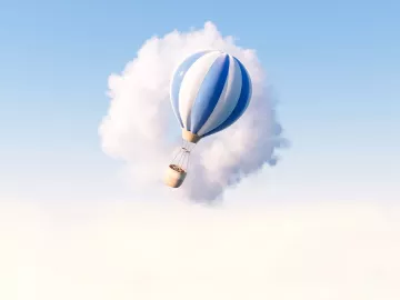 An illustration of a hot-air balloon passing in front of a cloud.