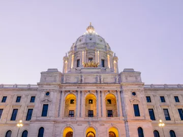 The Minnesota state capitol lit up at dusk.