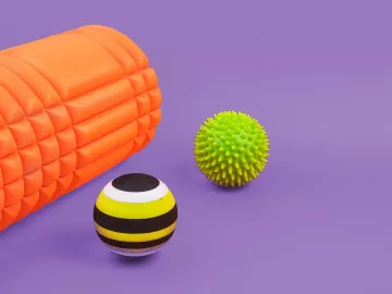 A therapy roll and two therapy balls.
