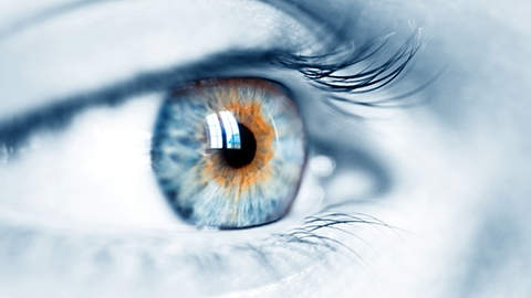 image of a person's eye with a blue hue.