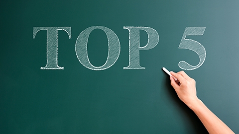 Image of a chalkboard with top 5 written on it.