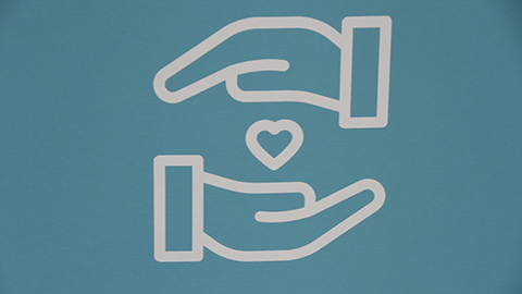 Animated image of two hands over a heart.