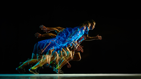Stroboscopic sprint start with overlapping runner motion on black background