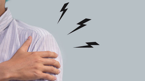 Pain in the shoulder joint of a young man. Concept of frozen shoulder.